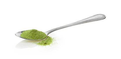 Instant green tea powder in spoon on white background