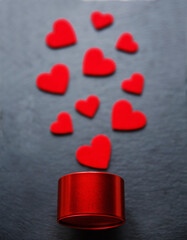 Valentine's day background with little red gift box and heart decoration.