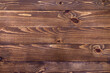 © blinova - New brown wood background made of dark natural wood in grunge style. The view from the top. Natural raw planed texture of coniferous pine. The surface of the table to shoot flat lay. Copy space