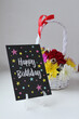 Happy Birthday. Postcard, bright flowers in a basket