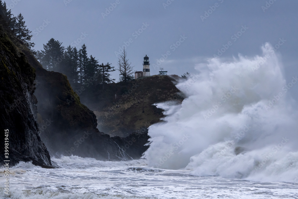 Large waves crashing against cliffs at Cape Disappointment on the ...