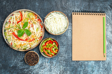 top view delicious vegetable salad with cabbage and bell-peppers on light-grey background health lunch diet color photo