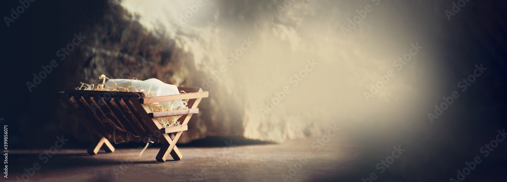Nativity scene. Christian Christmas concept. Birth of Jesus Christ. Wooden manger in cave background. Banner, copy space. Jesus is reason for season. Salvation, Messiah, Emmanuel, God with us. Hope - obrazy, fototapety, plakaty 