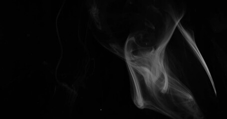 Wall Mural - Smoke background. White smoke floating through space against black background	