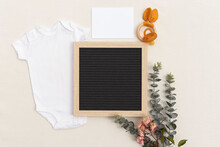 Blank Pregnancy Announcement Mockup Flat Lay With Blank Baby Vest, Space Or Sonogram, Pacifier And Toy