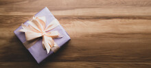Purple Gift Box On Wooden Table