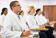 © JackF - Portrait of male doctor attentively listening to lecture with colleagues at medical conference