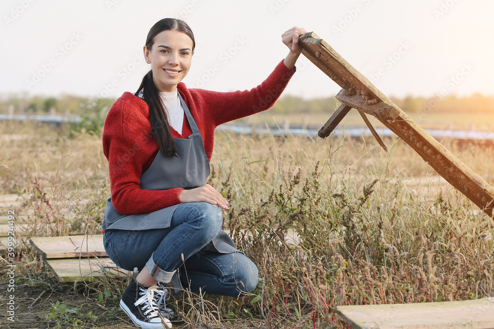 Worker taking care of snails at the farm