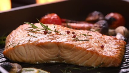 Wall Mural - Grilled salmon on pan on the flaming grill