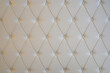 Warm white diamond upholstery background. Interior, furniture texture concept.