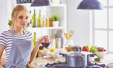 Young Woman Cooking in the kitchen. Healthy Food