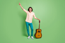 Full Length Body Size View Of Nice Glad Crazy Cheerful Guy Hipster Having Fun Playing Guitar Dancing Isolated Over Bright Green Color Background