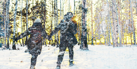 Canvas Print - double exposure photo with silhouette people in winter forest