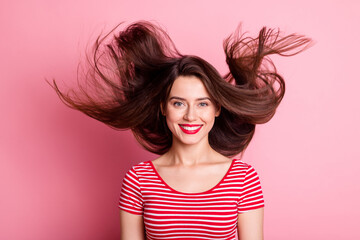 Poster - Photo of attractive young person flying perfect healthy hair satisfied isolated on pink color background