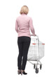 © ASDF - Rear view of casual woman with empty shopping cart on white background
