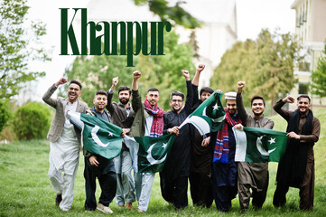 Khanpur city. Group of pakistani man wearing traditional clothes with national flags. Biggest cities of Pakistan concept.