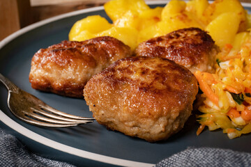 Sticker - Meatballs  served with fired potatoes.