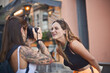 © olly - woman photographs her friend making a face