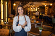 © Dragana Gordic - Portrait of a beautiful waitress working at a restaurant using a tablet computer and smiling. Portrait of a happy waitress working at a restaurant and looking at the camera