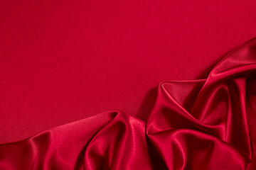 Wall Mural - Red silk satin background. Copy space for text or product. Wavy soft folds on shiny fabric. Luxurious bright red background. Valentine, Christmas, anniversary, holiday, celebration.