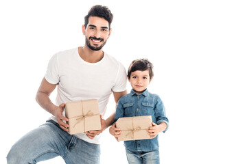 happy hispanic man with smiling son holding gifts isolated on white, two generations of men