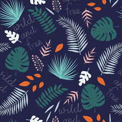  Vector seamless pattern with tropical leaves and inscription Wild and Free on dark background. For wallpapers, decoration, invitation, fabric, textile and print, gift and wrapping paper.