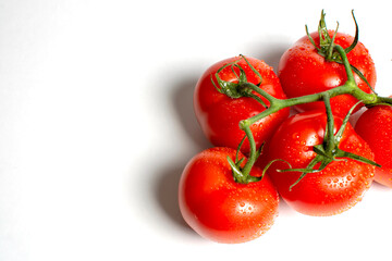 juicy ripe tomatoes on a white background close up