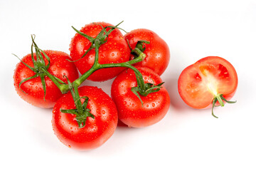 Wall Mural - whole and slices of red tomatoes on a white background