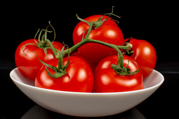 Wall Mural - juicy ripe tomatoes on a white plate close up