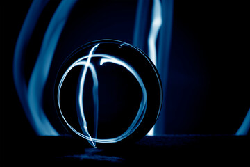 Wall Mural - Abstract composition with a crystal ball in darkness. 