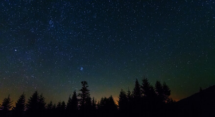 Wall Mural - fantastic starry night with galaxy milky way with a tourist and a tent on the mountain range in the 