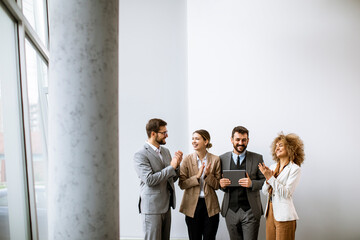 Wall Mural - Multiethnic young business people working together in the office