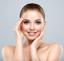 Beautiful Face Of Young Smiling Woman With Clean Fresh Skin - Isolated.  Young White Happy Woman With A Clean Skin.