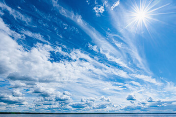 Wall Mural - panorama of calm lake, kama river blue sky with clouds reflected in the water.