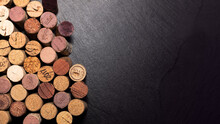 Wine Theme Banner With Wine Corks Over A Slate Board With Copy Space