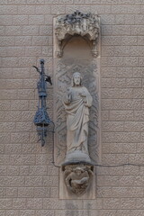 elements of architectural decorations of buildings, religious sculptures and crosses on the streets in Catalonia in public places.