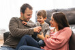 © Louis-Paul Photo - happy family mother and father having fun with child son at home