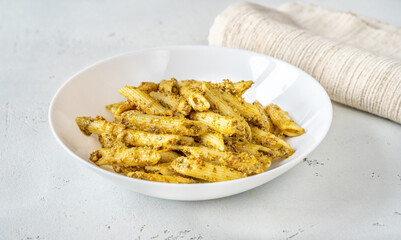 Wall Mural - Portion of penne pasta with pesto sauce