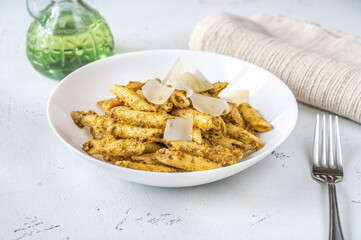 Wall Mural - Portion of penne pasta with pesto sauce