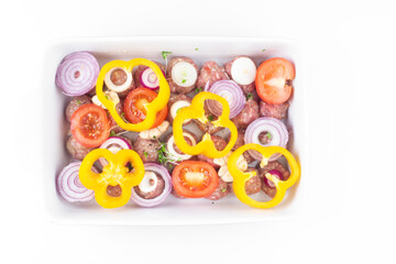 Wall Mural - raw meat balls with vegetables and microgreens isolated on white