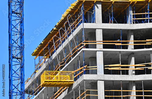 Fototapeta Crane and highrise construction site