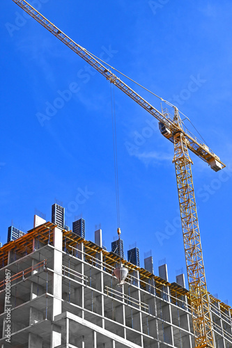 Fotografie, Obraz Crane and highrise construction site