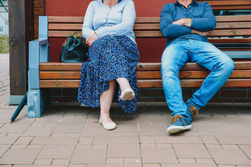 Poster - People waiting at the station bench. Waiting for the arrival of the train, bus.