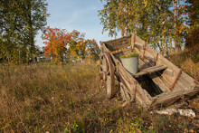 On A Country Road, An Old Cart. Autumn Sunny Day