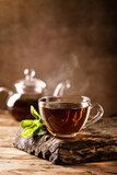 Fototapeta Niebo - Cup of hot tea with fresh mint leaves