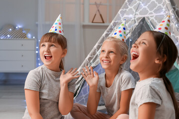 Wall Mural - Cute little girls celebrating birthday at home