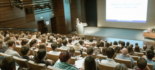 Wall Mural - speaker giving a talk on scientific conference. audience at the conference hall. business and entrep