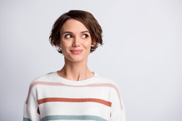 Poster - Close-up portrait of lovely cheery brown-haired girl looking aside copy empty place space isolated over grey pastel color background