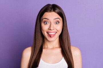 Poster - Photo of charming tricky young lady dressed casual white clothes showing tongue isolated purple color background