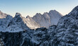 Peak Ganek (Ganok) with Galeria Gankowa (Galeria Ganku) and ridge - Gran Konczystej (hreben Koncistej) in winter scenery. Tatra Mountains.
